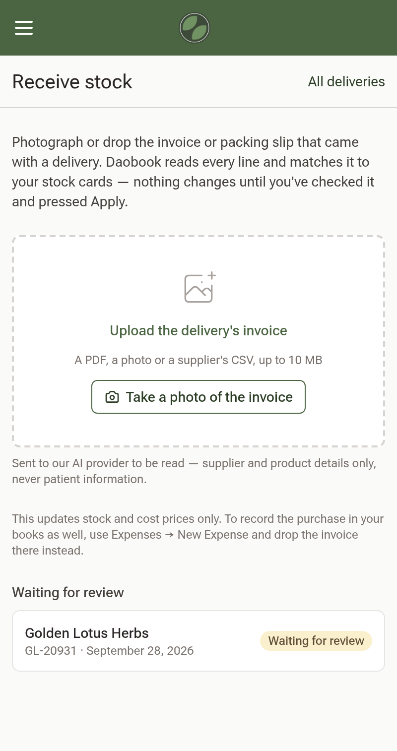 The Receive stock page on a phone, with the upload box, the Take a photo of the invoice button, and one delivery from Golden Lotus Herbs waiting for review